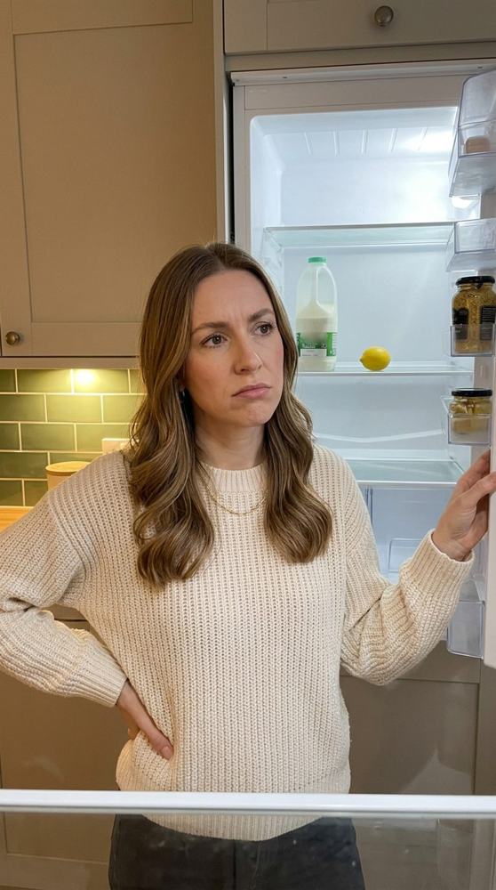 Looking into an almost empty fridge on a weekday evening